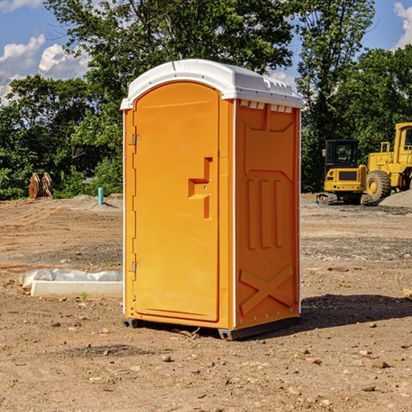 what is the cost difference between standard and deluxe porta potty rentals in Monon